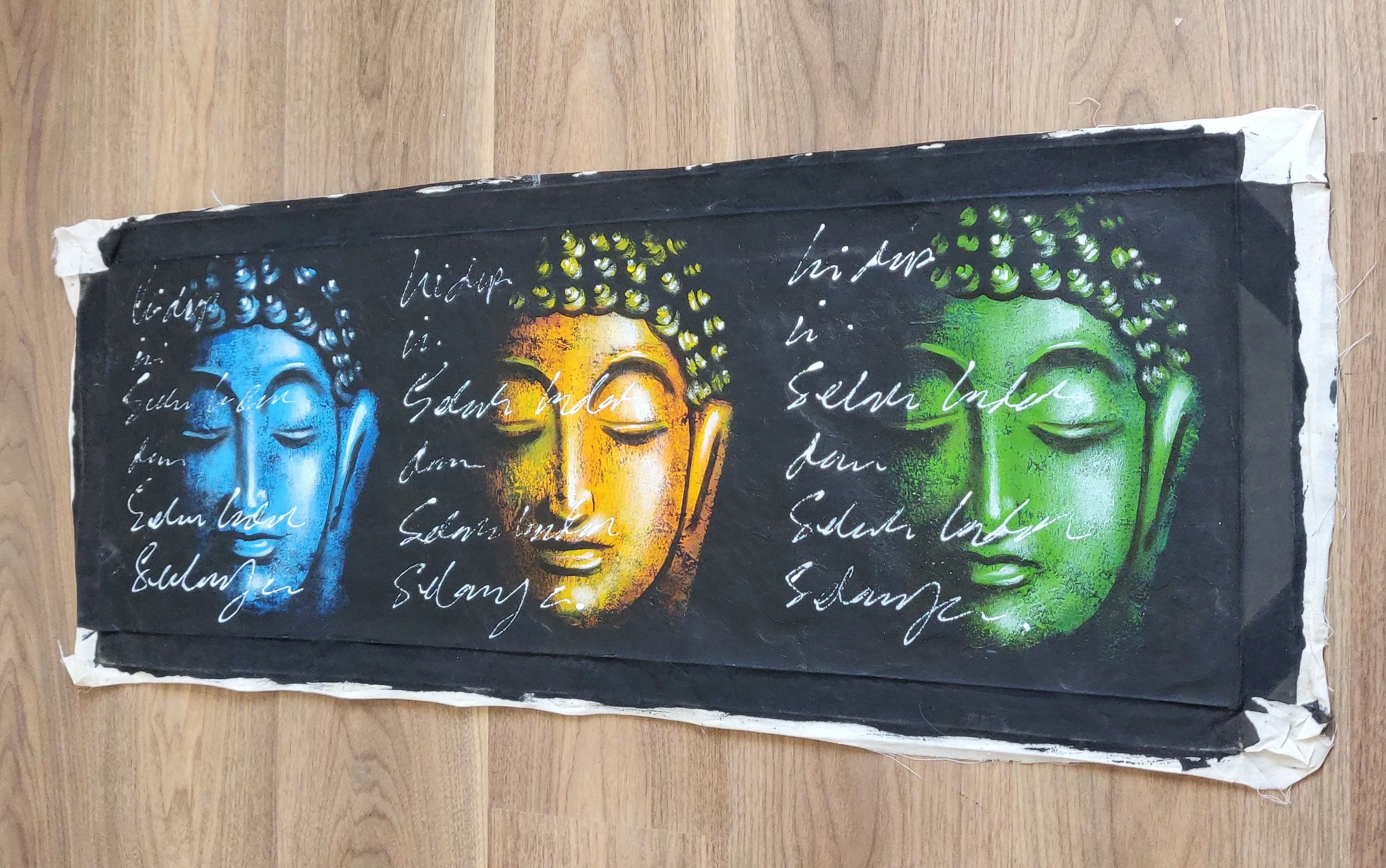 Home Decor: Wall Hangings.
Hand Painted Lord Buddha Serene face motifs - Wonder, Silence, Gratitude. Size 98 by 37 cm. Unframed